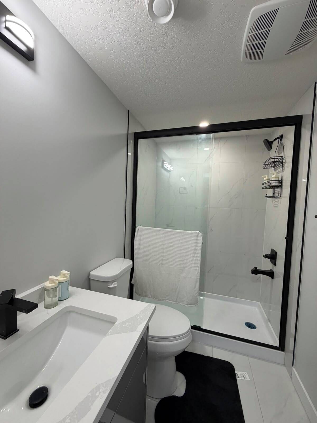 Shower, hair dryer, towels, soap