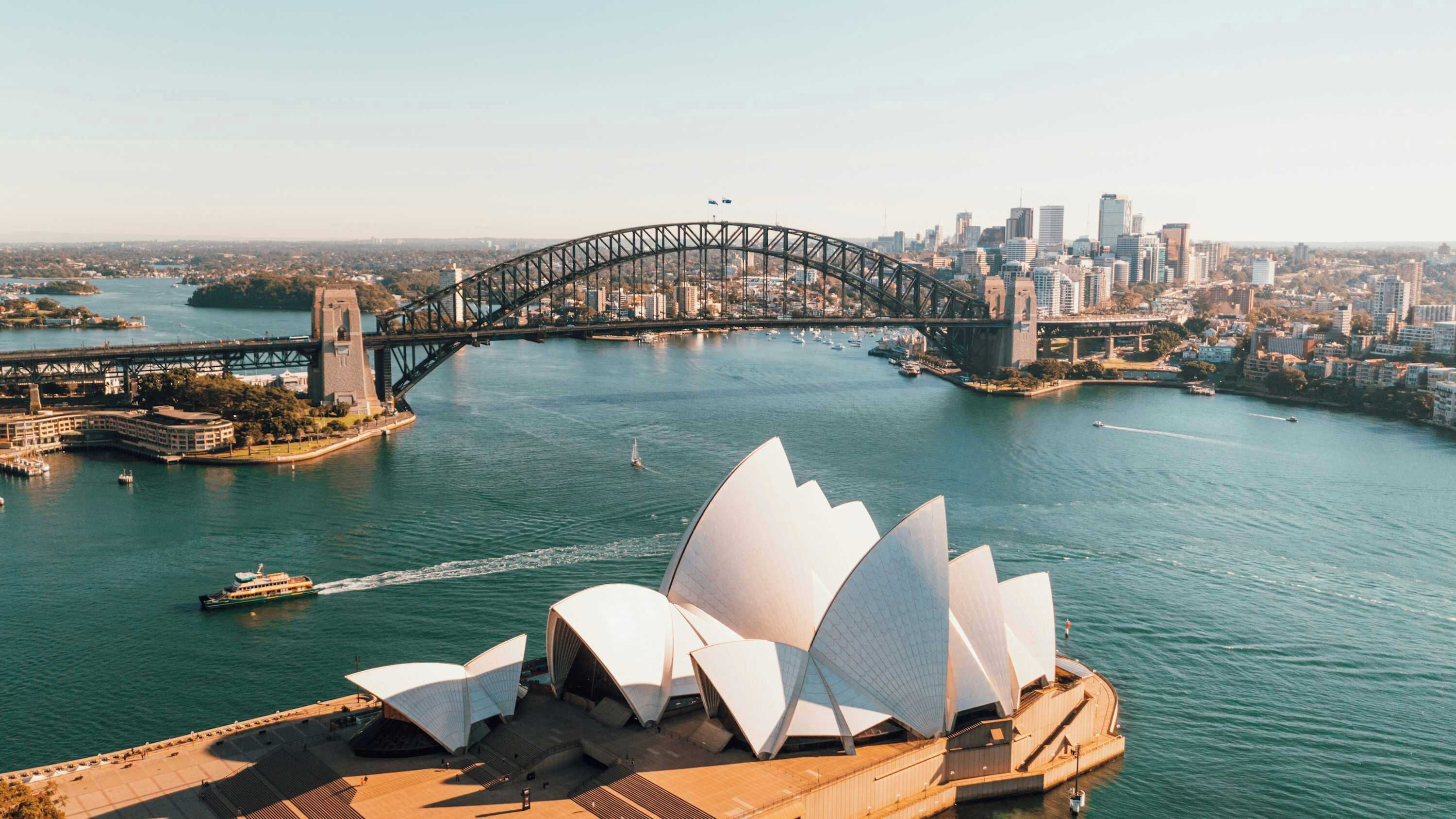 The Sydney Opera House with the Sydney Harbour Bridge in the background.