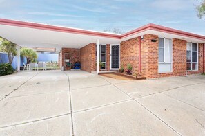 A two-story brick house with a covered patio area. - Urban Comfort - Close to Fremantle (Hilton)