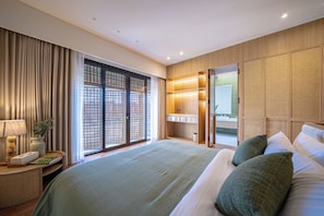 A hotel room with a large bed, a bedside table with a lamp, a window with curtains, and a view of the outside. - Villa Anaka Pererenan (Pererenan)
