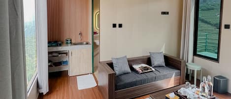 Luxury Suite, 1 Queen Bed, Balcony, Mountain View | Living area | 43-inch Smart TV with digital channels