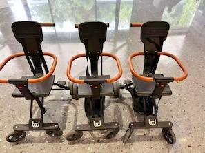 Three mobility scooters with wheels and footrests, labeled with the logo 'tcd'. - Chengdu Yuelanli S Hotel (Chengdu)