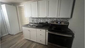 Coffee/tea maker, fridge, microwave, oven