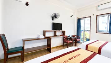 Family Room | Minibar, desk, WiFi (free), bed sheets