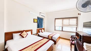 Family Room | Minibar, desk, WiFi (free), bed sheets