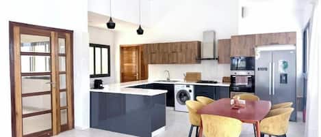 Coffee/tea maker, fridge, microwave, oven