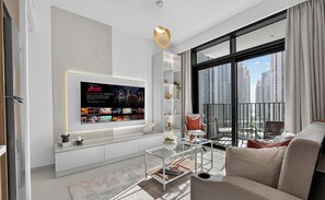 Departamento de lujo, 1 cama King size y sofá cama, vista a la ciudad | Área de sala de estar