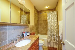 A bathroom with a sink, toilet, and bathtub. - Quiet Home in Walkable Area: 3 Mi to National Mall (Washington)