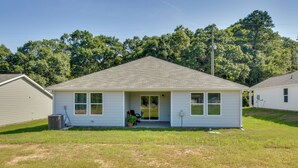 A single-story house with a front porch, a small attached garage, and a lawn. - Lake Hartwell Home Base: 2 Mi to Marina! (Hartwell)