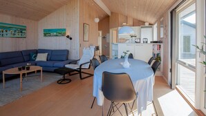 A modern interior with a living area, dining space, and kitchen. - Beach front home in Vestervig with WiFi (Vestervig)