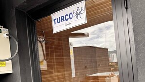 A modern building entrance with a sign reading 'Turco Turkish.' - Luxury Loft  Jacuzzi, Gym and steam bath  Laureles (Medellín)