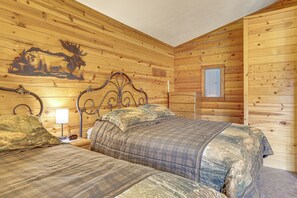 A wooden cabin room with two beds, a nightstand, a wall clock, and a window. - Mississippi River Basecamp! Studio 24 Mi to Winona (Cochrane)