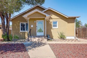 A single-story house with a front door, two windows, and a small porch. - Near Riverwalk & Lake Adventures! Pueblo Home (Pueblo)