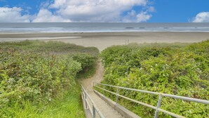 A coastal pathway leading to a beach with a clear sky and sea. - Walk to Beaches! Lincoln City Family Home w/ Yard (Lincoln City)