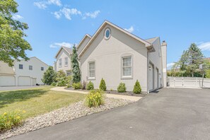 A single-story residential building with a garage, a well-maintained lawn, and a clear sky. - Spacious Sinking Spring Home w/ Outdoor Oasis! (Sinking Spring)