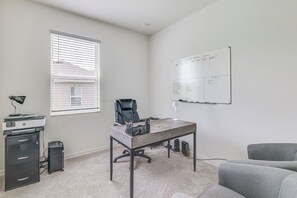 A small office with a desk, chair, and a whiteboard on the wall. - Home Office! Mascotte Family Escape Near Hospital (Mascotte)