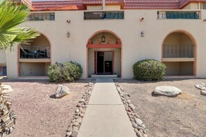 A building with a central entrance, two side wings, and a gravel pathway leading to the entrance. - Walkable & Renovated Gem! Only 8 Mi to Dtwn Tucson (Tucson)