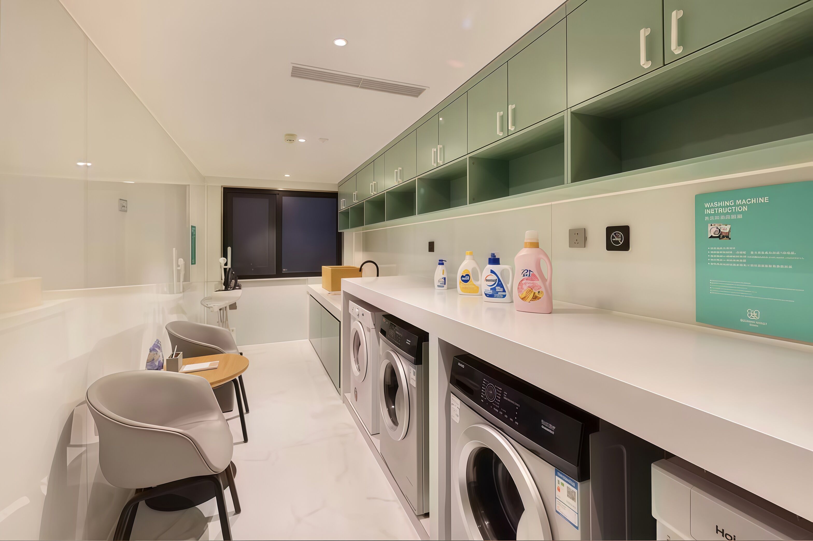 A modern laundry room with a washing machine, dryer, and neatly organized shelves with cleaning supplies.