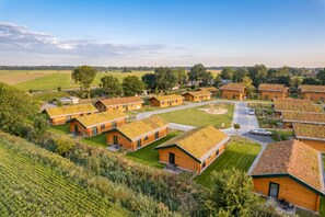 A residential area with multiple houses featuring sloped roofs, likely for rainwater collection. - Accessible vacation home "Huus Hunbloom" in Kating for up to 4 people (Kating)