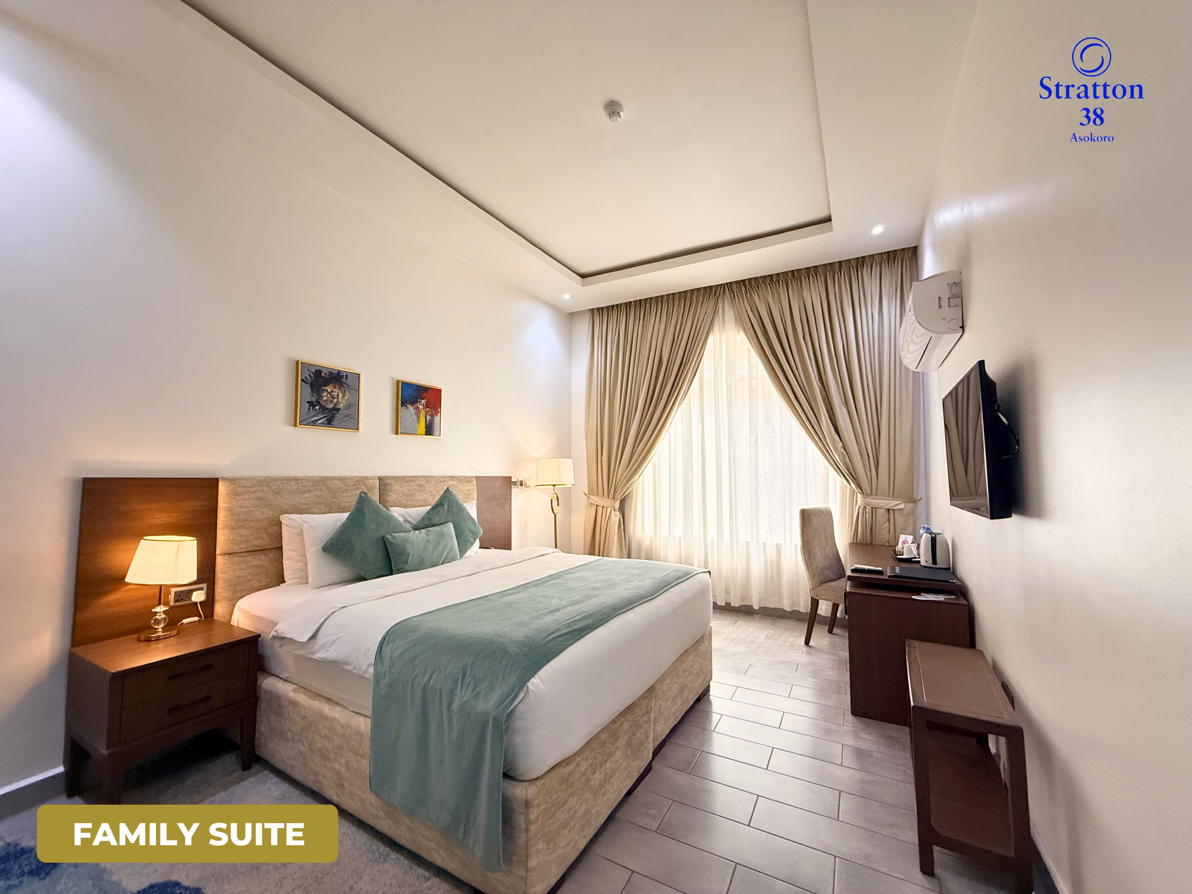 Family Suite, City View | In-room safe, desk, laptop workspace, blackout curtains