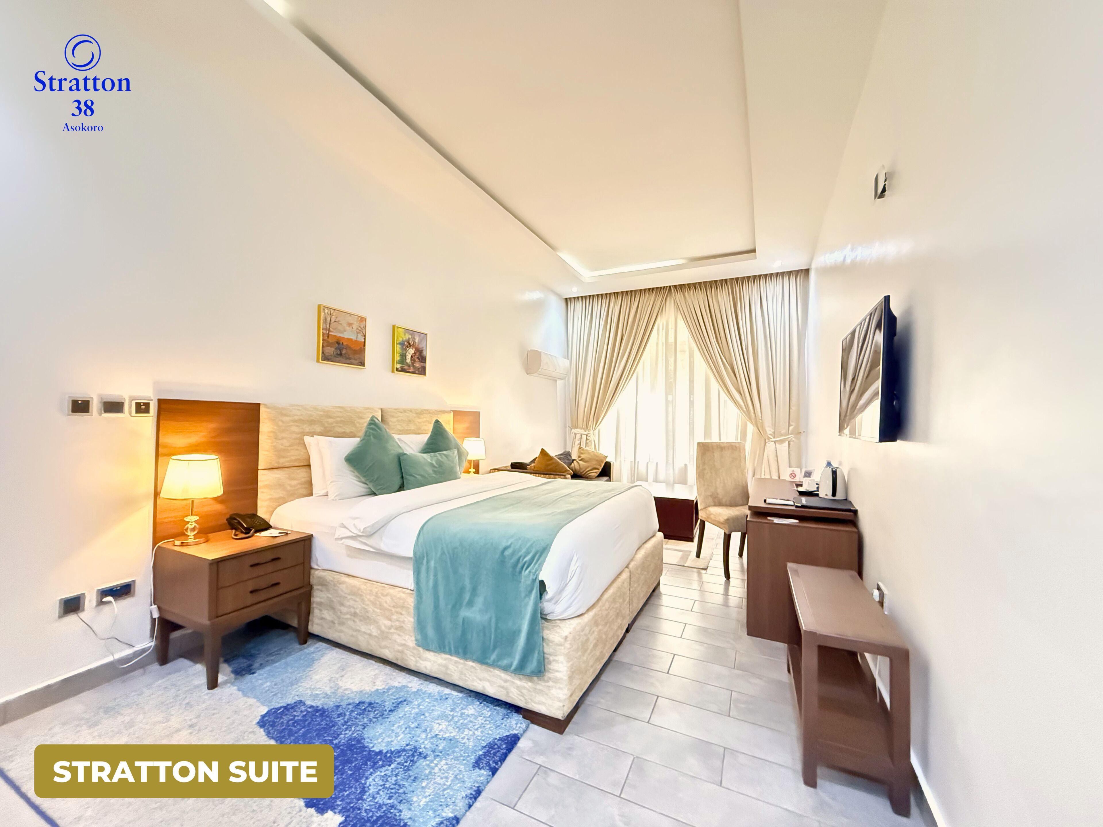 Signature Suite | In-room safe, desk, laptop workspace, blackout curtains
