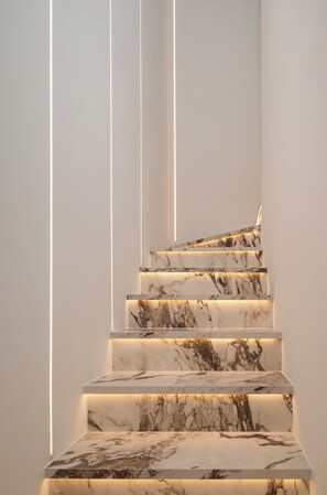 A staircase with marble steps and underlighting. - Villa Silvio (Kožino)