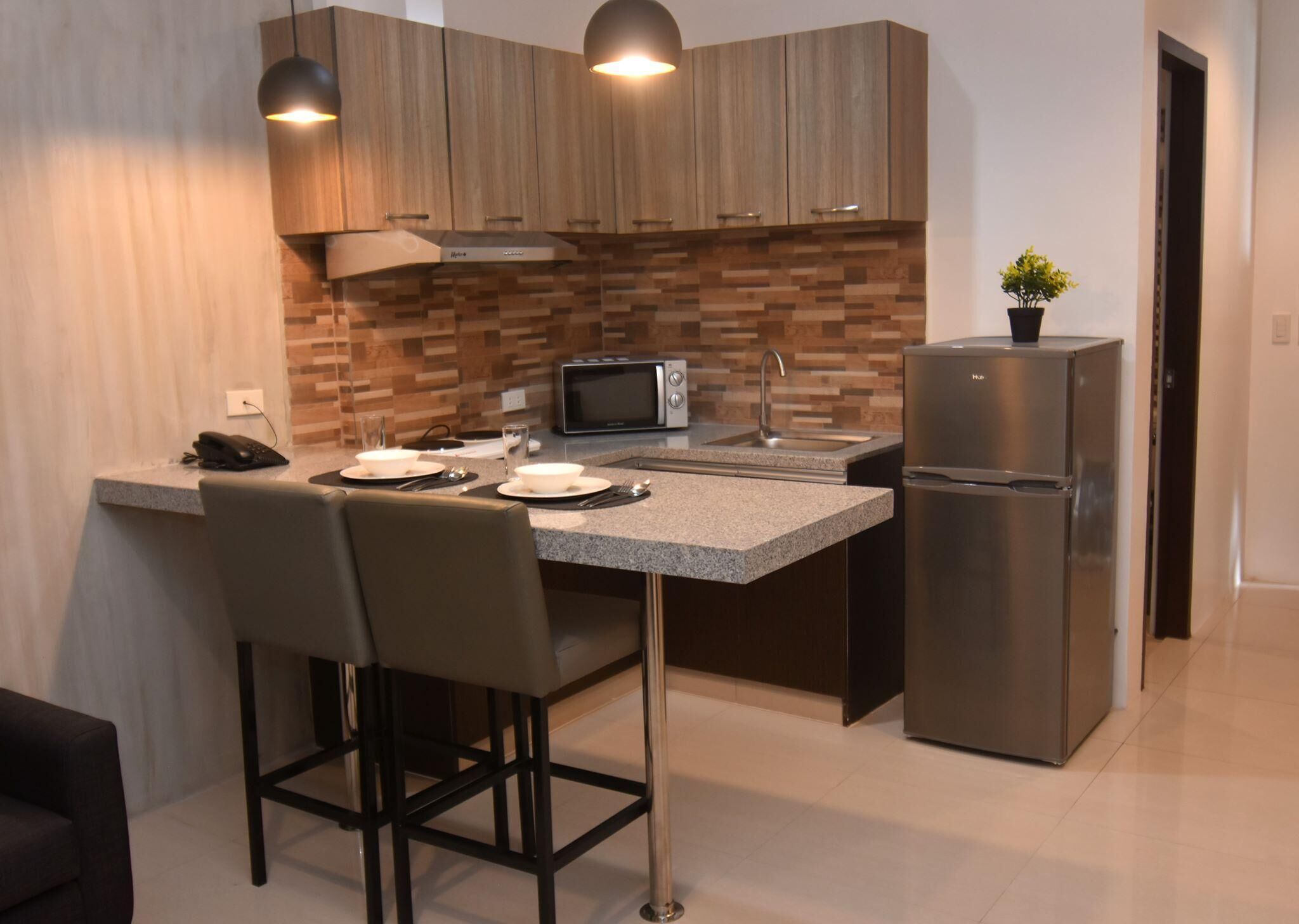 Suite, 2 habitaciones | Cocina privada | Frigorífico grande, microondas, placa de cocina y utensilios de cocina