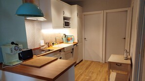 Een koelkast, een oven, een vaatwasser