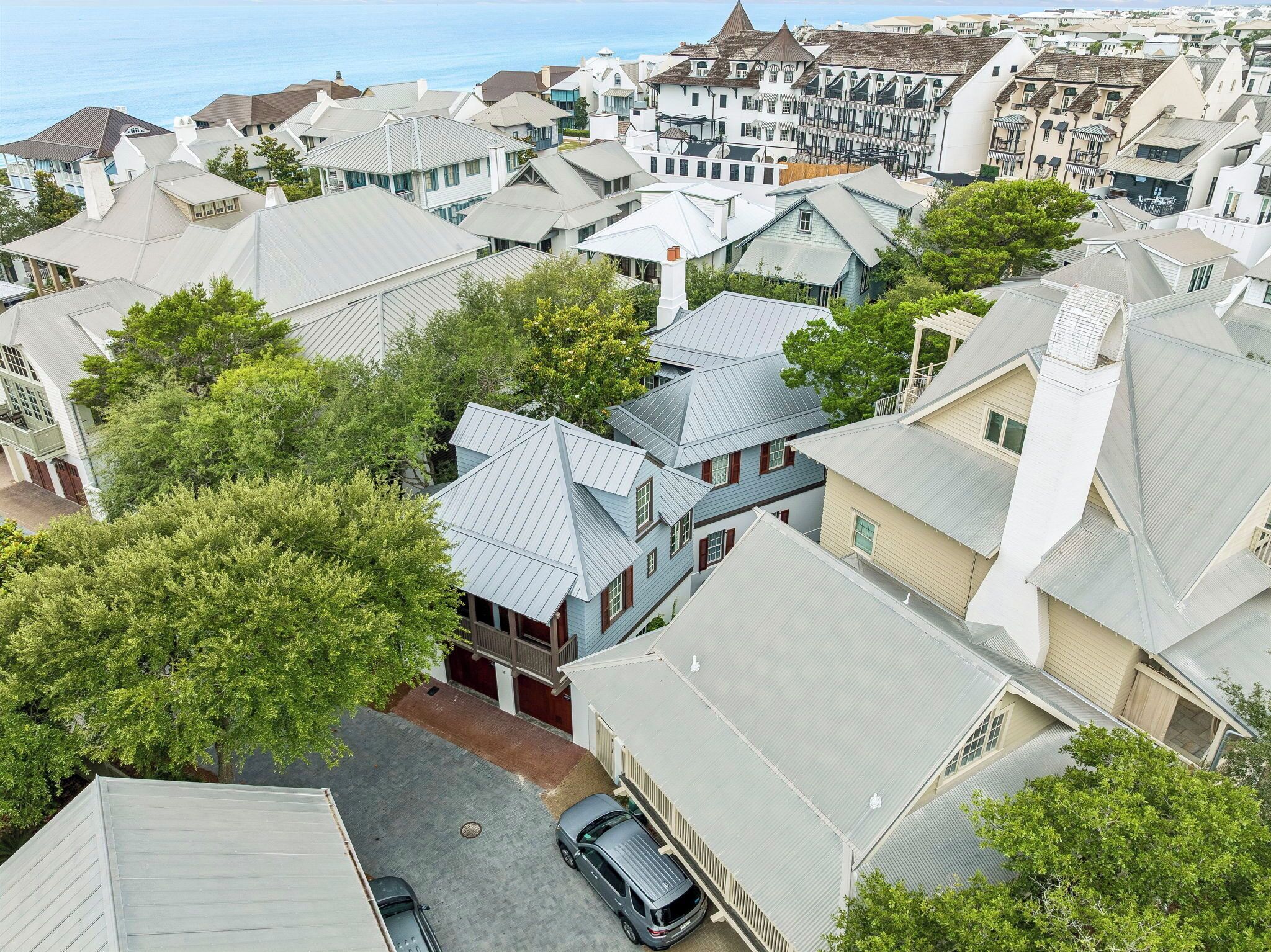 A residential area with houses featuring gabled roofs and a variety of architectural styles.