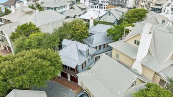 A residential area with houses featuring gabled roofs and a variety of architectural styles.