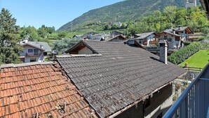 A mountainous village with traditional stone buildings and terraced fields.