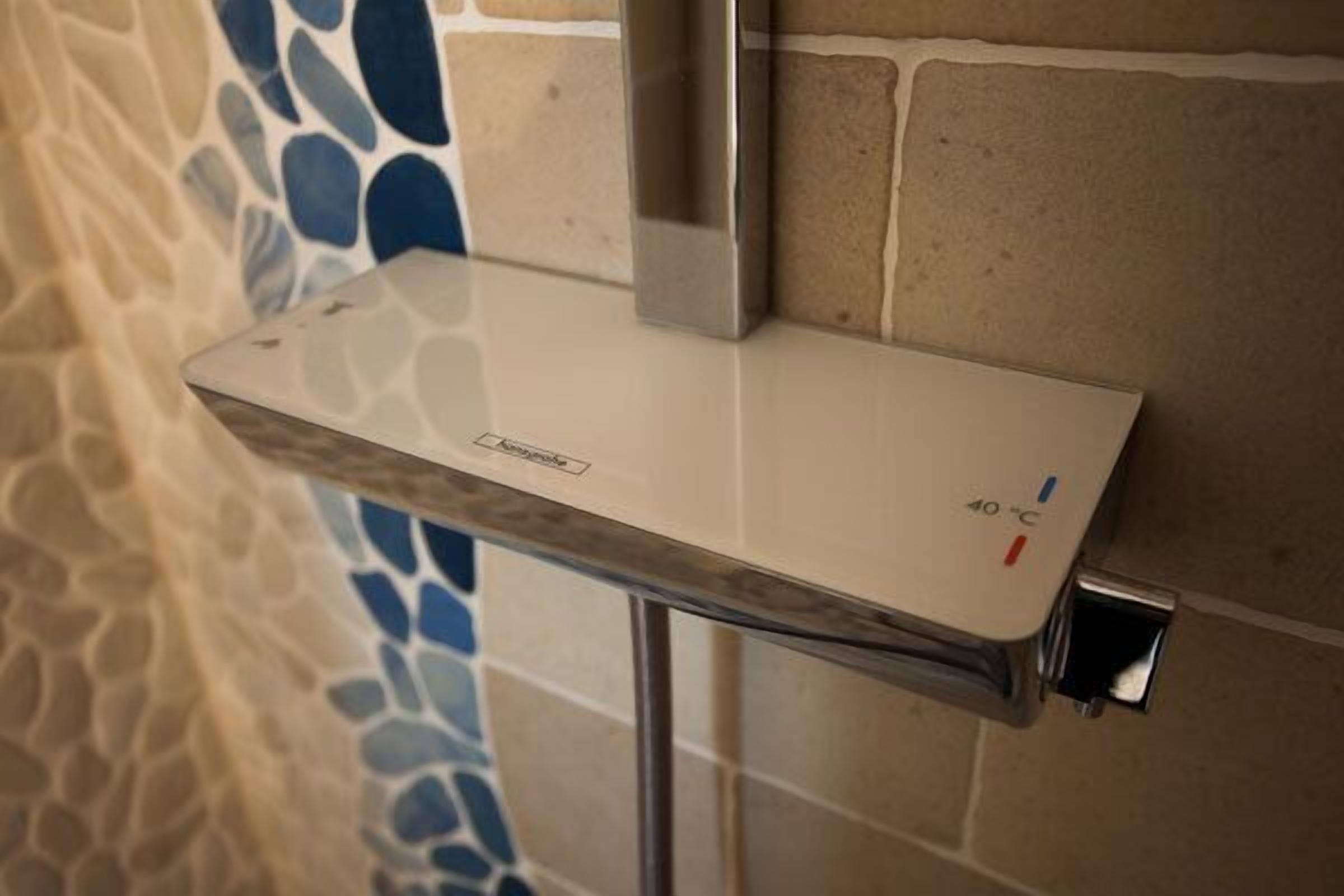 A white countertop with a control panel displaying temperature settings.