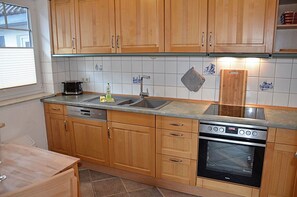 Coffee/tea maker, fridge, microwave, oven