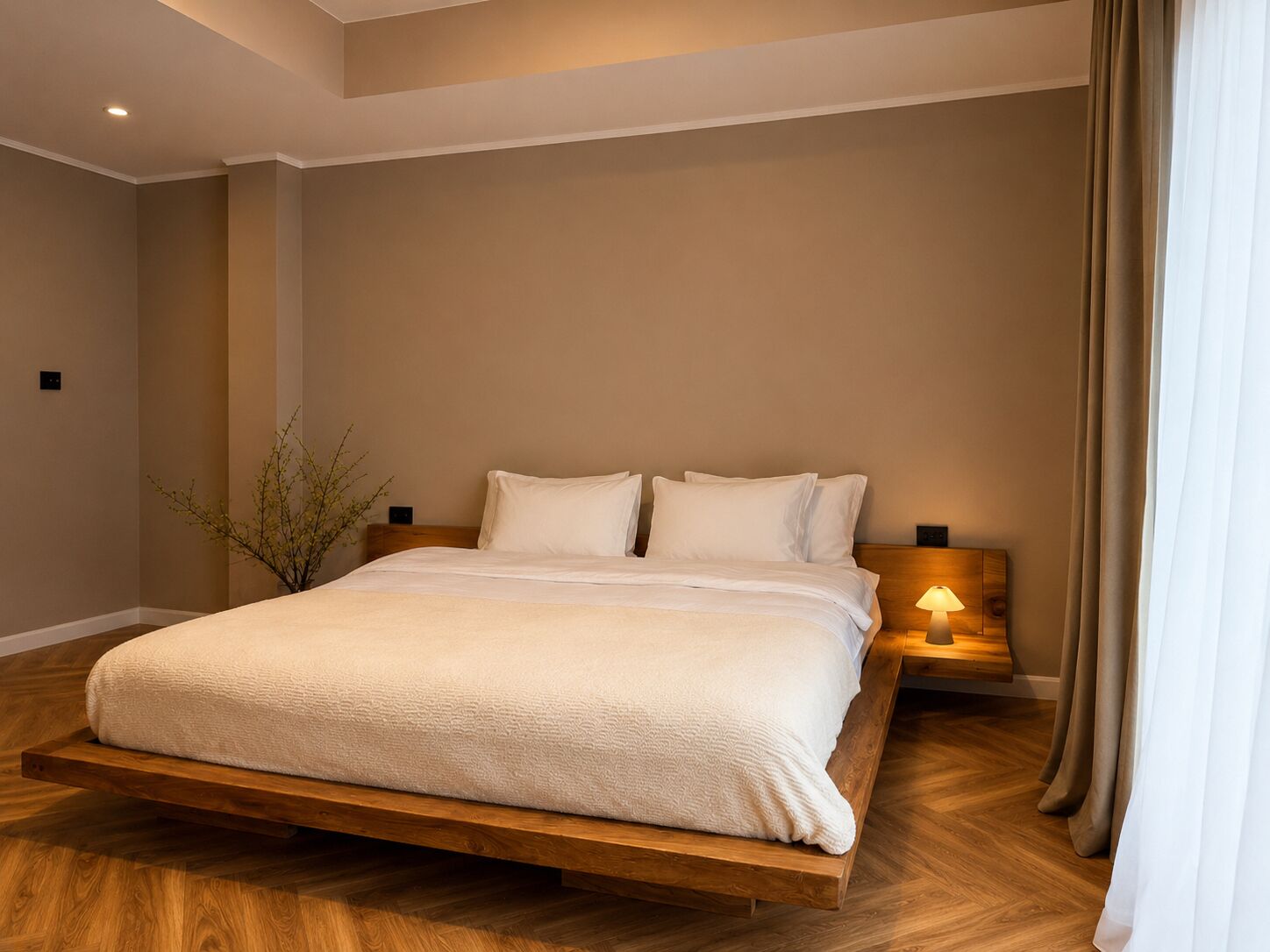 A modern bedroom with a wooden bed frame, white bedding, and a bedside lamp.