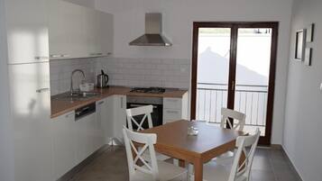 Departamento Confort, vista al mar | Cocina privada