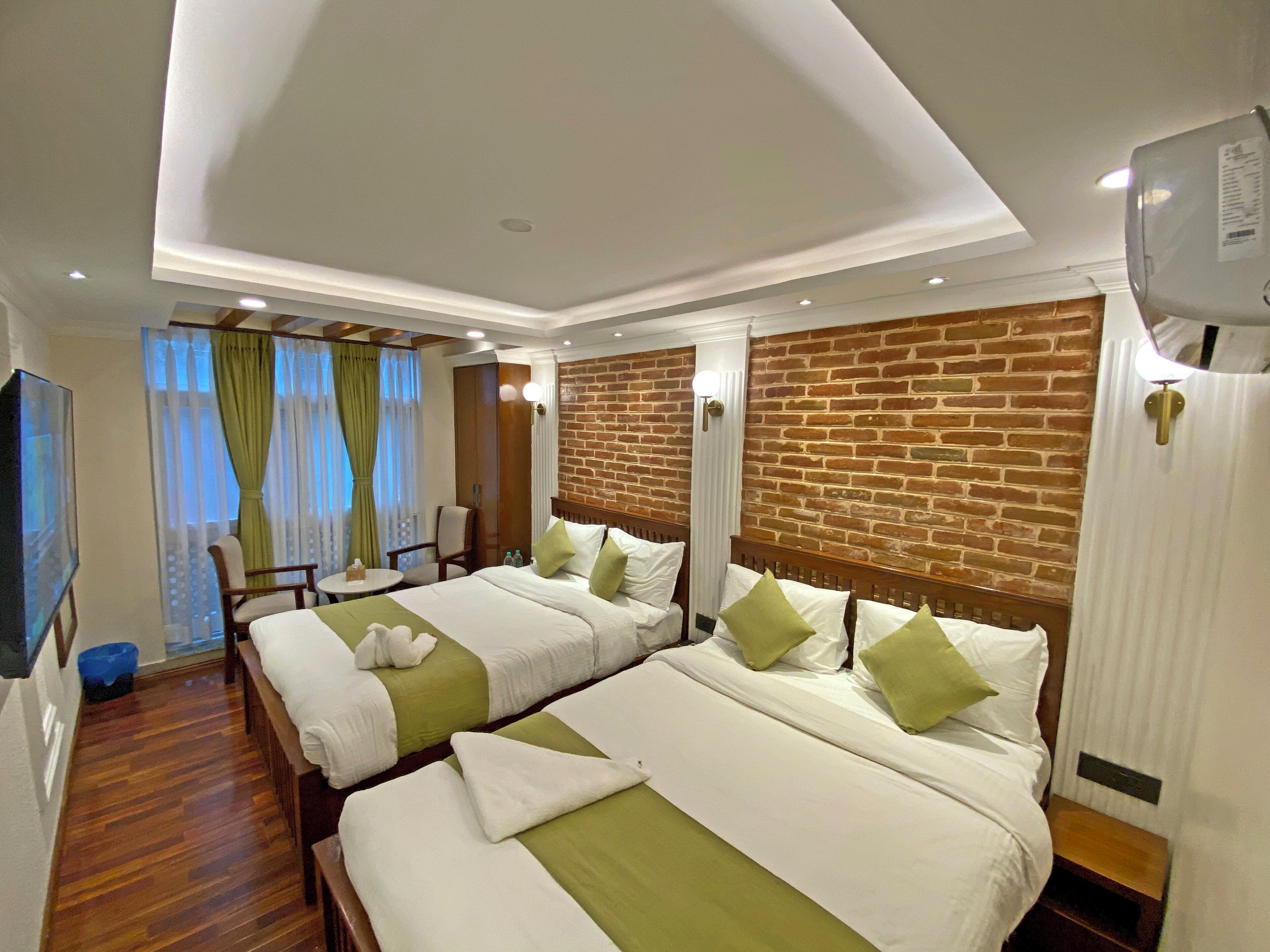 Deluxe Quadruple Room, City View | Desk, laptop workspace, WiFi (free)