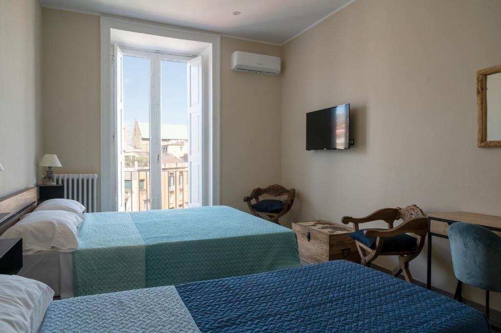 Deluxe Quadruple Room, Private Bathroom, City View