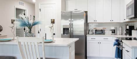 Coffee/tea maker, fridge, microwave, oven