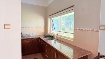 Standard Triple Room, Garden View | Private kitchen | Fridge, microwave, electric kettle