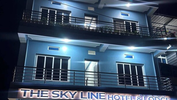 A multi-story hotel with a prominent sign reading 'The Sky Line Hotel & Lodge.' - The SkyLine Hotel (Bhedetar)
