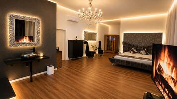 Suite | Living area | 65-inch LED TV with digital channels, streaming services