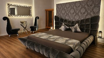 Sursee Silver Luxury Suite (Private spa with whirlpool and infrared sauna) | Living area | 65-inch LED TV with digital channels, streaming services