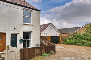 A residential building with a front door, a mailbox, and a number '25' on the wall. - Family Home With Sea Views (Cromer)
