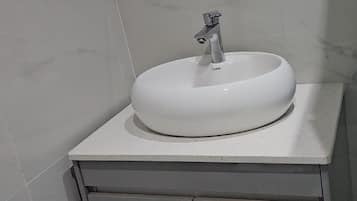 Shower, towels, toilet paper