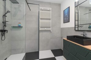 A modern bathroom with a shower, a toilet, a sink, and a mirror. - Minecraft-Inspired Apartment | Game Console (Jastrzębia Góra)