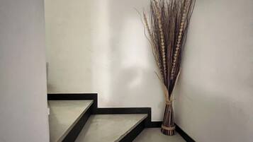 A staircase with a framed picture above it.