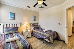 A hotel room with two beds, a ceiling fan, and artwork on the walls. - Pool & Game Room! Family Home 13 Mi to Disney (Davenport)