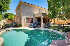 A two-story house with a swimming pool, outdoor seating, and a fenced yard. - Outdoor Oasis w/ Pool! Glendale Group Escape (Glendale)