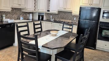 Coffee/tea maker, fridge, microwave, oven
