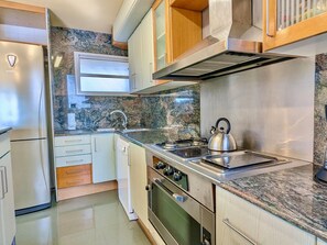 A modern kitchen with a stainless steel refrigerator, a built-in oven, a gas stove, and a kettle. - House with private pool, parking - 8 guests (Tossa de Mar)